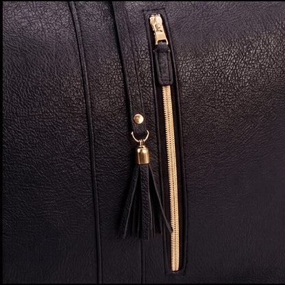 Charcoal bag zipper and tassel close-up